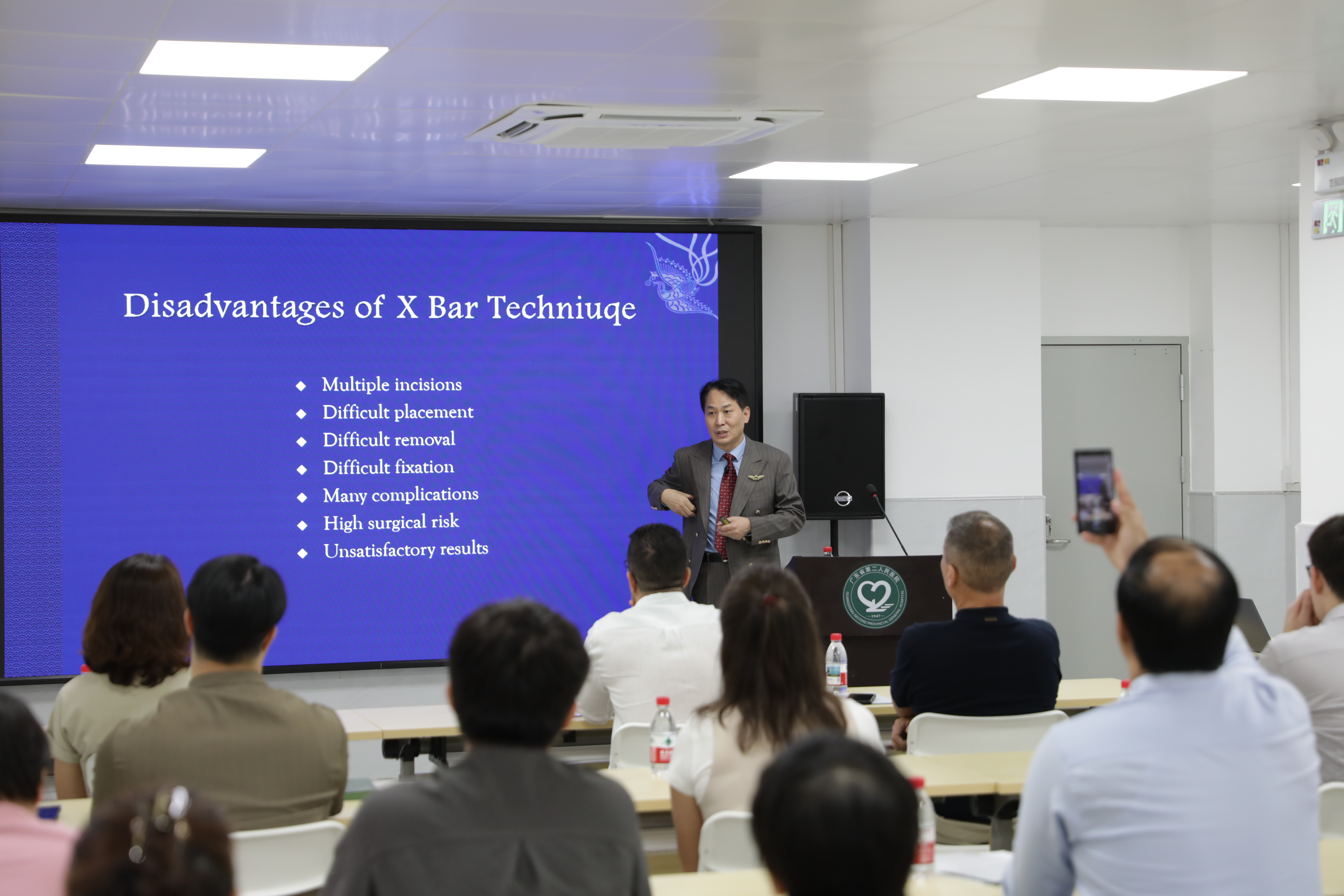Professor Wenlin Wang delivers a lecture during the training program.